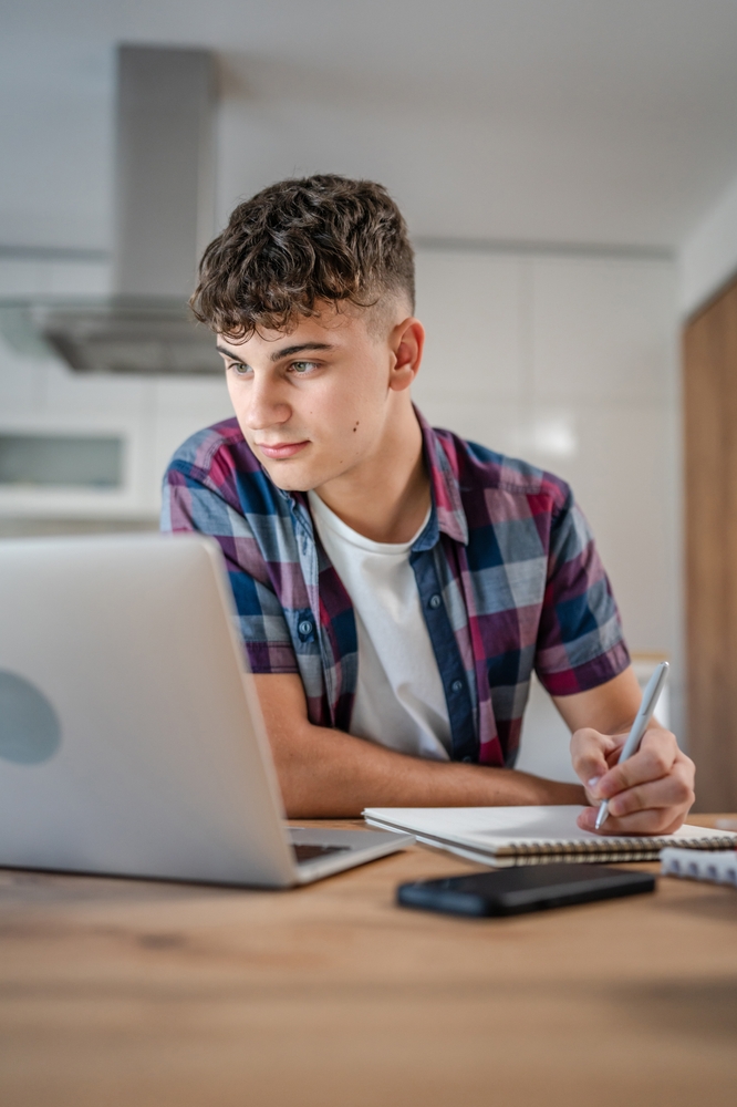 Young,Caucasian,Man,Teenager,Student,Study,At,Home